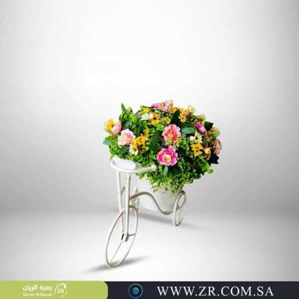 Iron basin bike arranged with artificial flowers